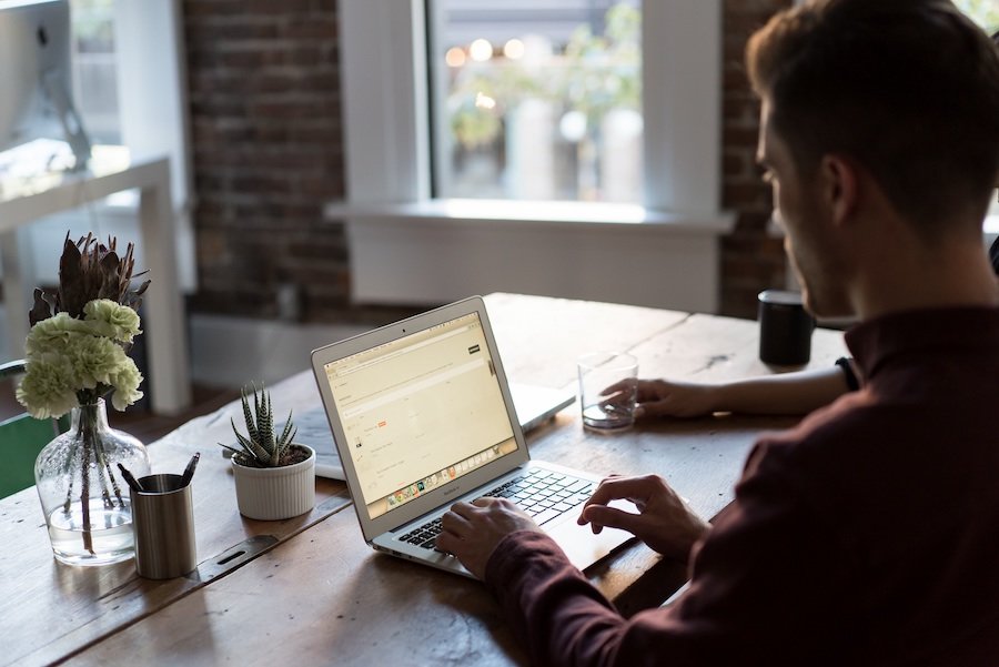 Young startup male using a laptop