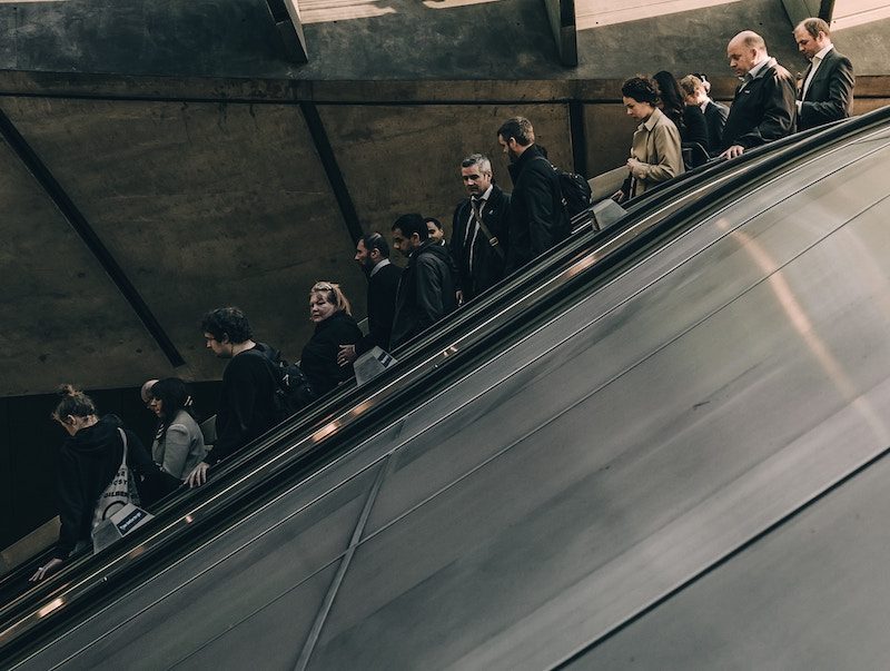 People Going down the escalator