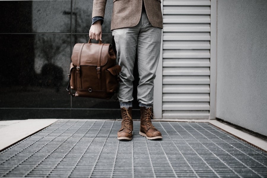 Beautiful leather Backpack held by a fashionable man