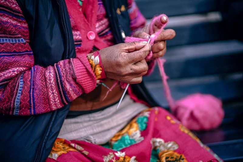 indian aunty weaving a scarf