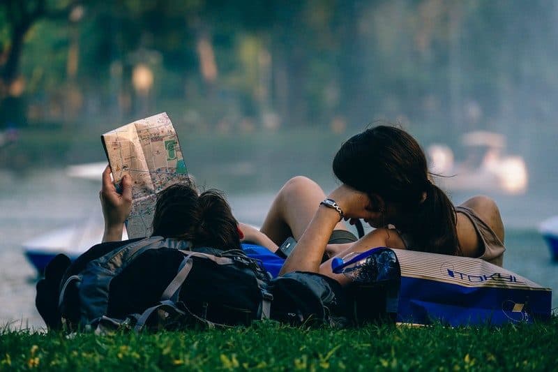 Couple looking at a local guide map in bangkok thailand