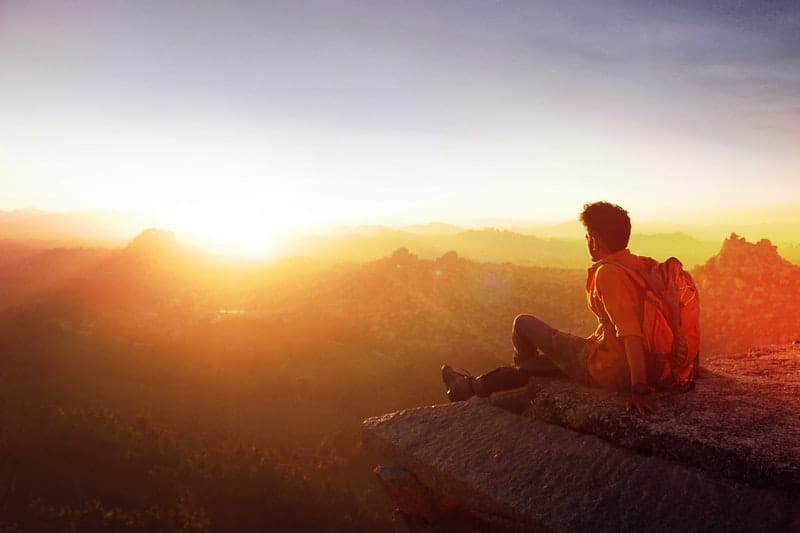 Indian man looking out into the sunset