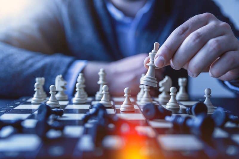 two people playing a fun game of chess together