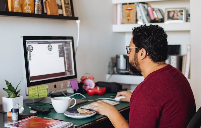 Graphic Designers Working with Adobe Illustrator in His Home Office