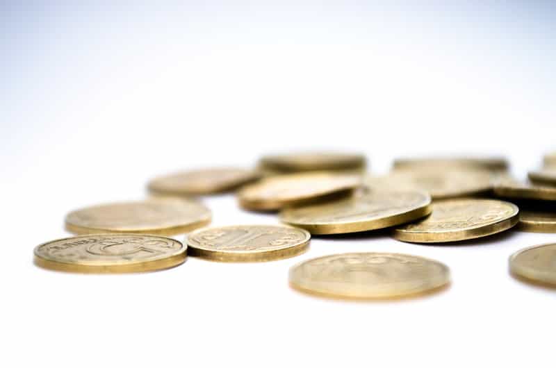 gold coins laying on a table