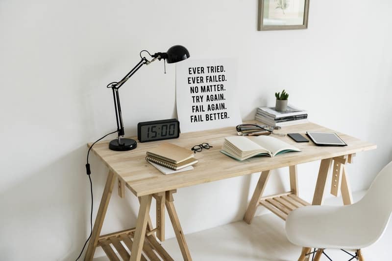 modern wooden home desk with books on top