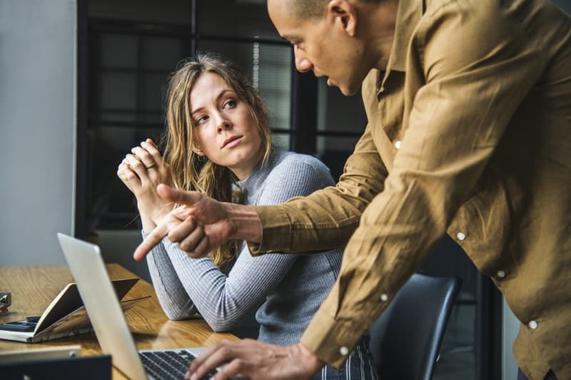 two coworkers discussing an idea