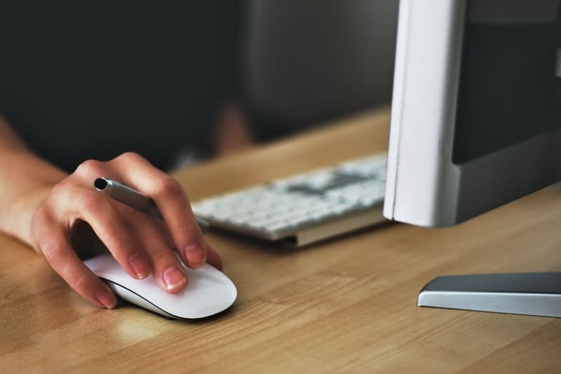 woman using an apple mouse