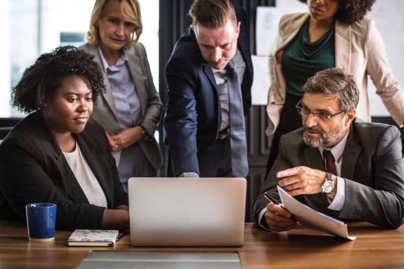 Group of Business Professionals Looking over a Strategic Plan