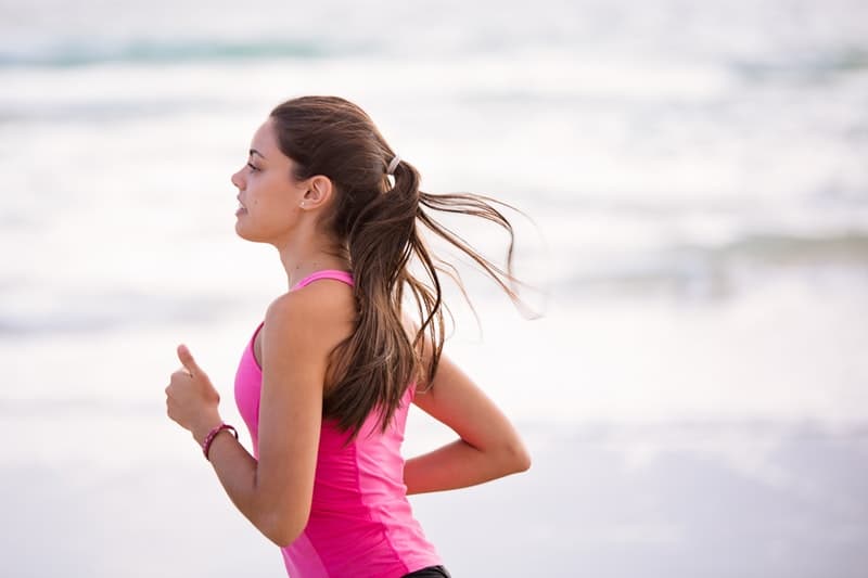 woman in pink shirt jogging