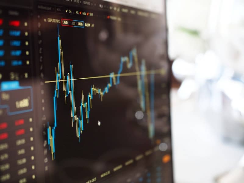 Blue and Yellow Graph on Stock Market Monitor