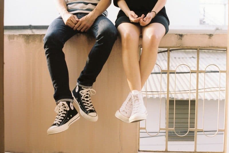boy and girl sitting together on a rooftop