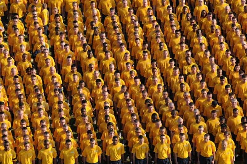 crowd of people wearing yellow shirts