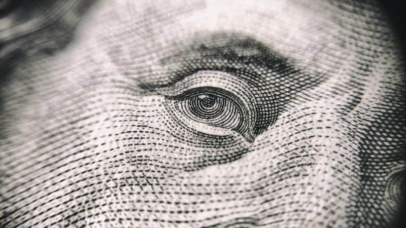 eye of benjamin franklin on the 100 dollar bill