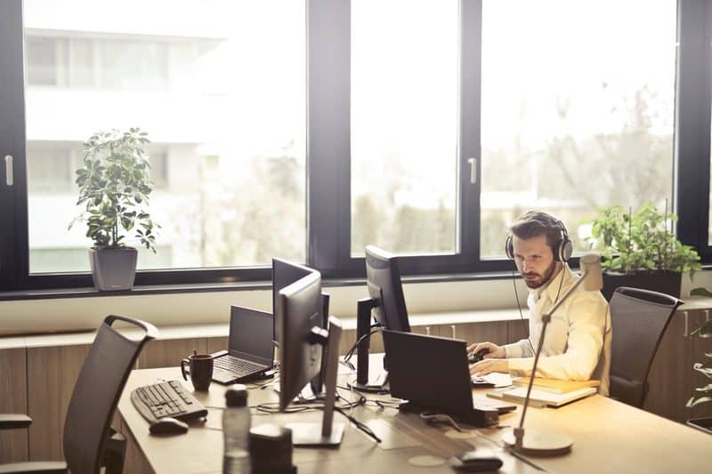 man answering customer service call at the office