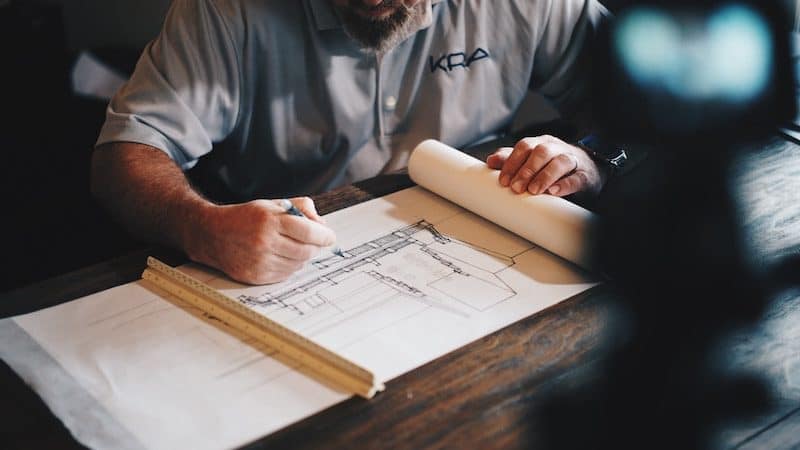 Architect Drawing a Building