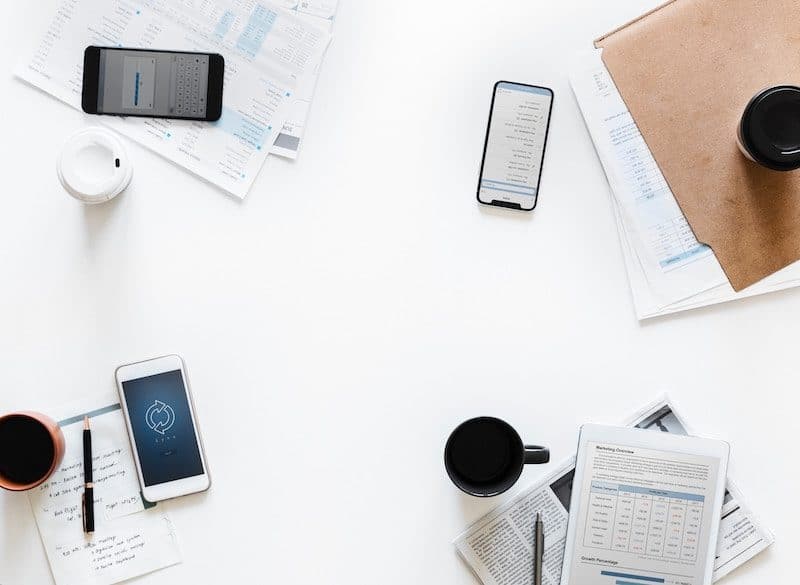 Business smartphones laying on a white desk