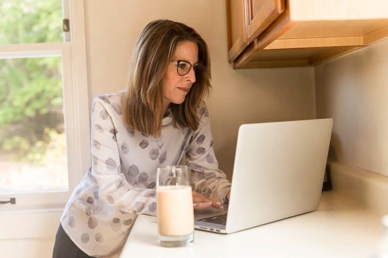 Elderly woman calculating life insurance