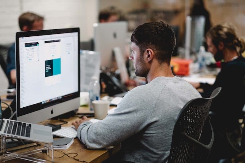 Man Sitting on an Ergonomic Office Chair