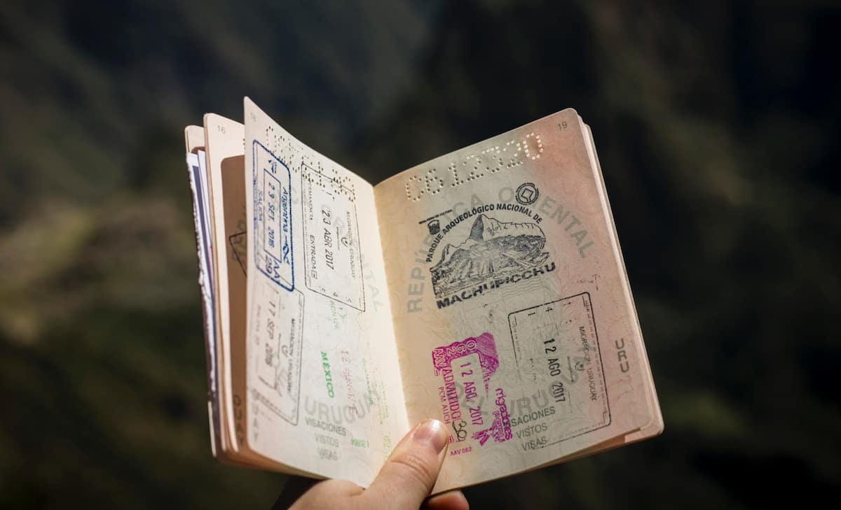 Passport open with different country stamps inside
