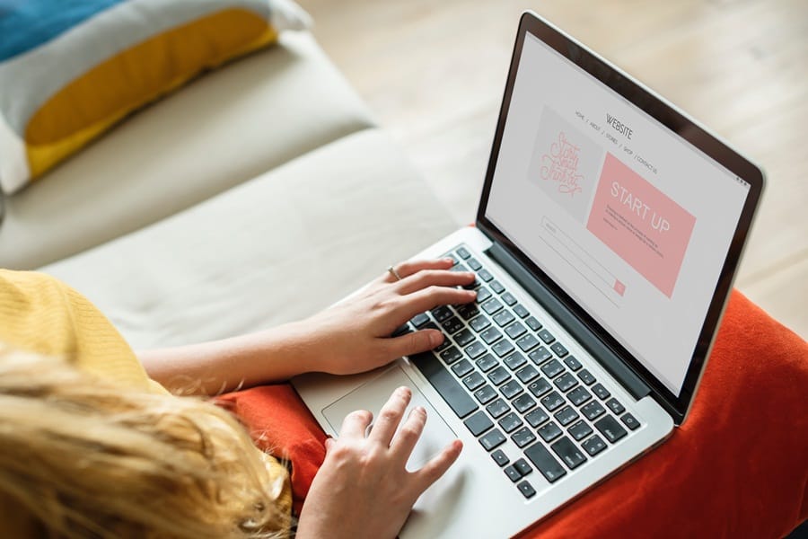 Woman working on a project on her computer