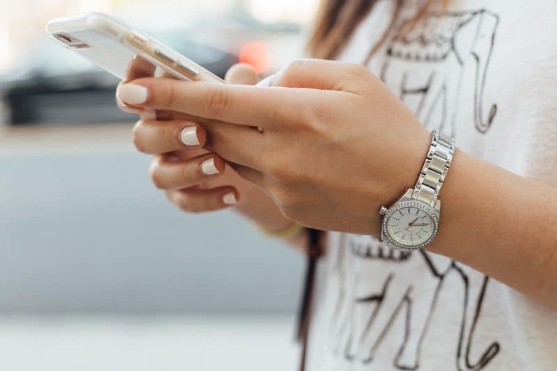 Young girl using her cell phone