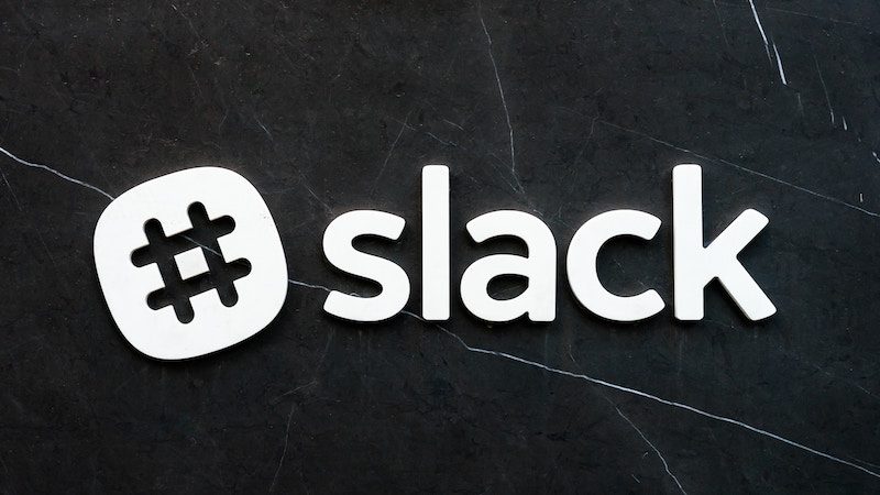 slack logo against a black wall