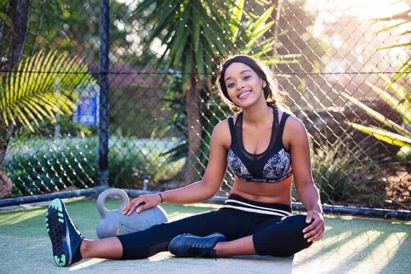 woman in gray and black sports bra