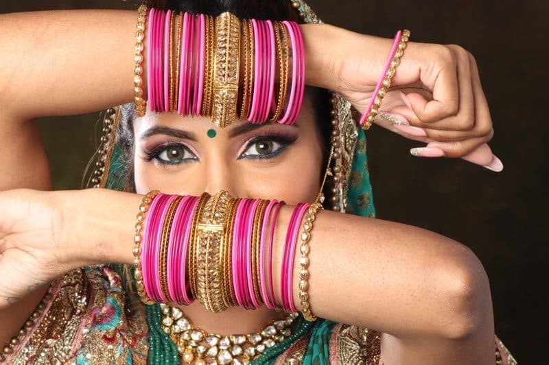 woman wearing plastic bangle bracelets