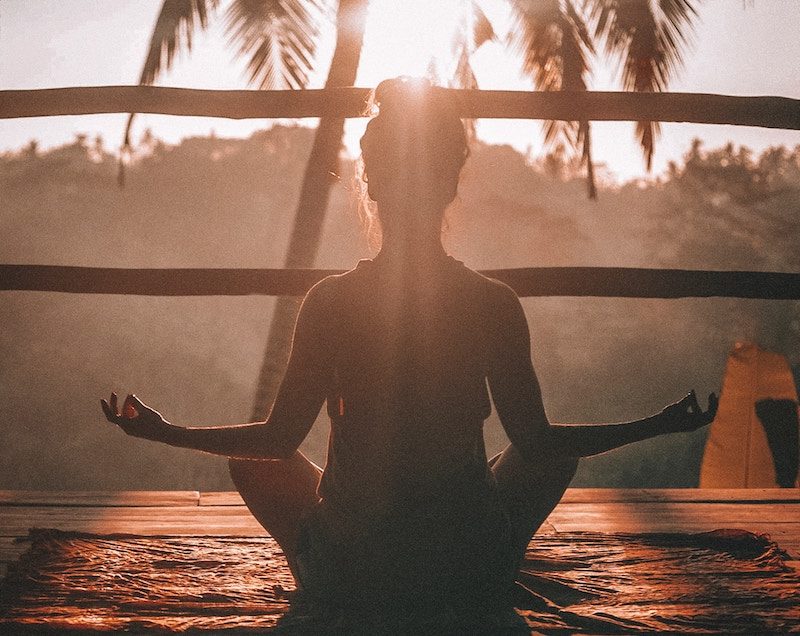 Woman meditating in the morning