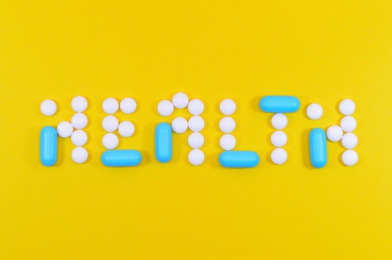 health spelled out with prescription pills