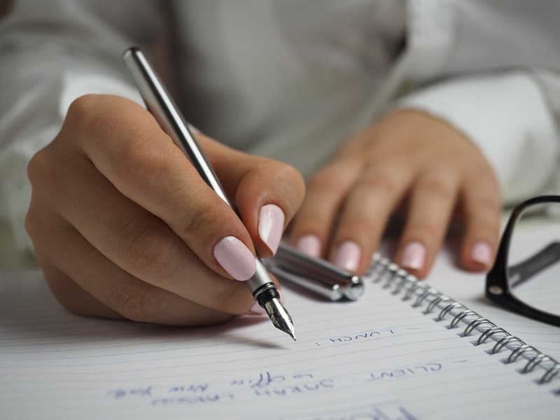 woman writing a to-do list