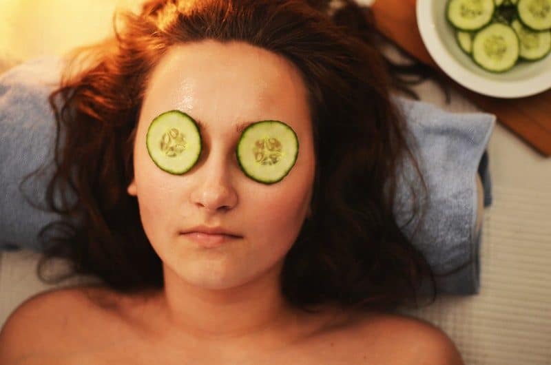cucumber on eyes of a woman