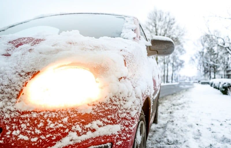 snow covered sedan