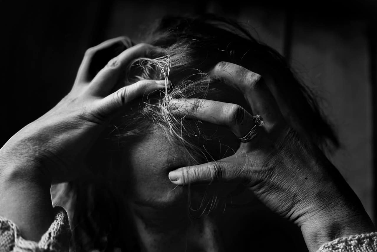 stressed out woman pulling her hair