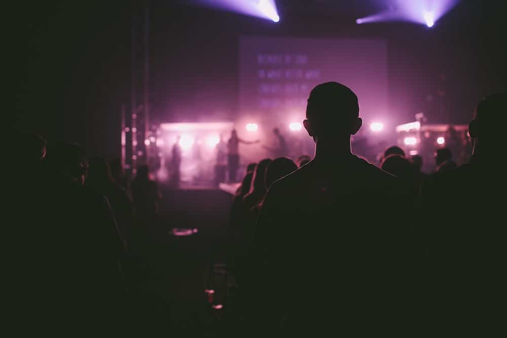 Man Dancing to live music at concert