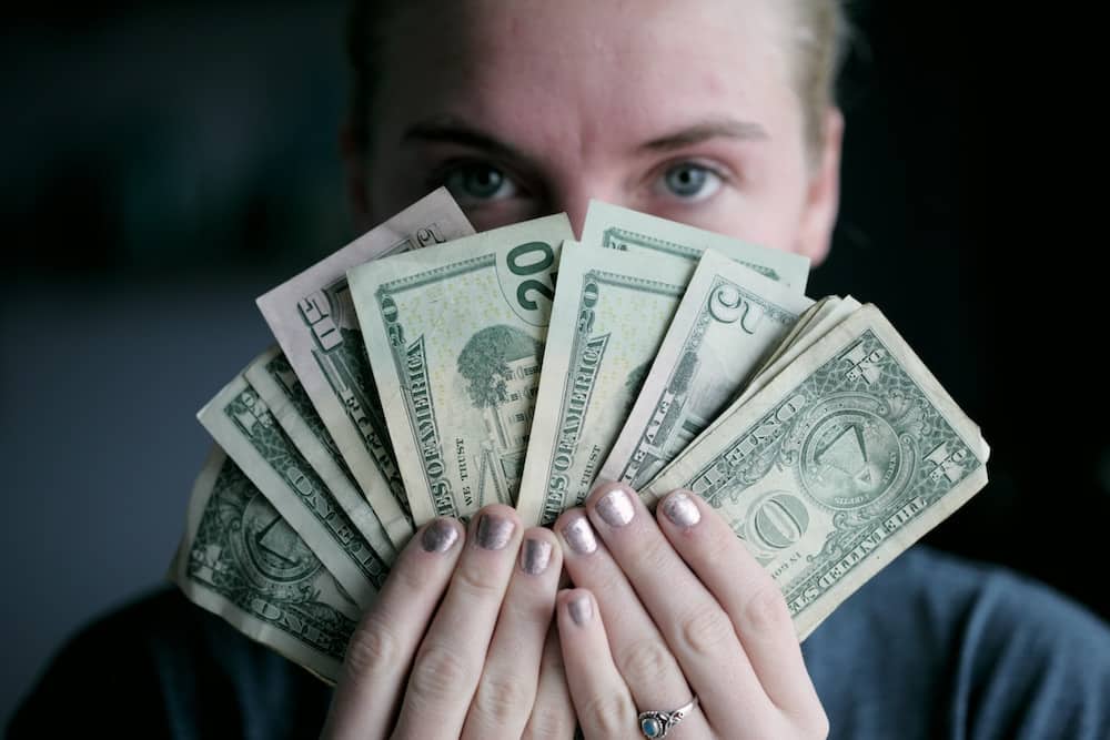 Woman Holding Money in Her hands