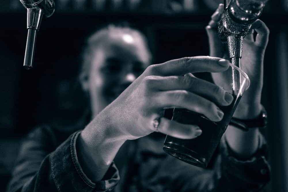 Woman pouring alcohol