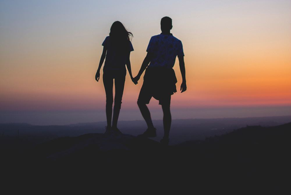 Couple Overlooking a Sunset