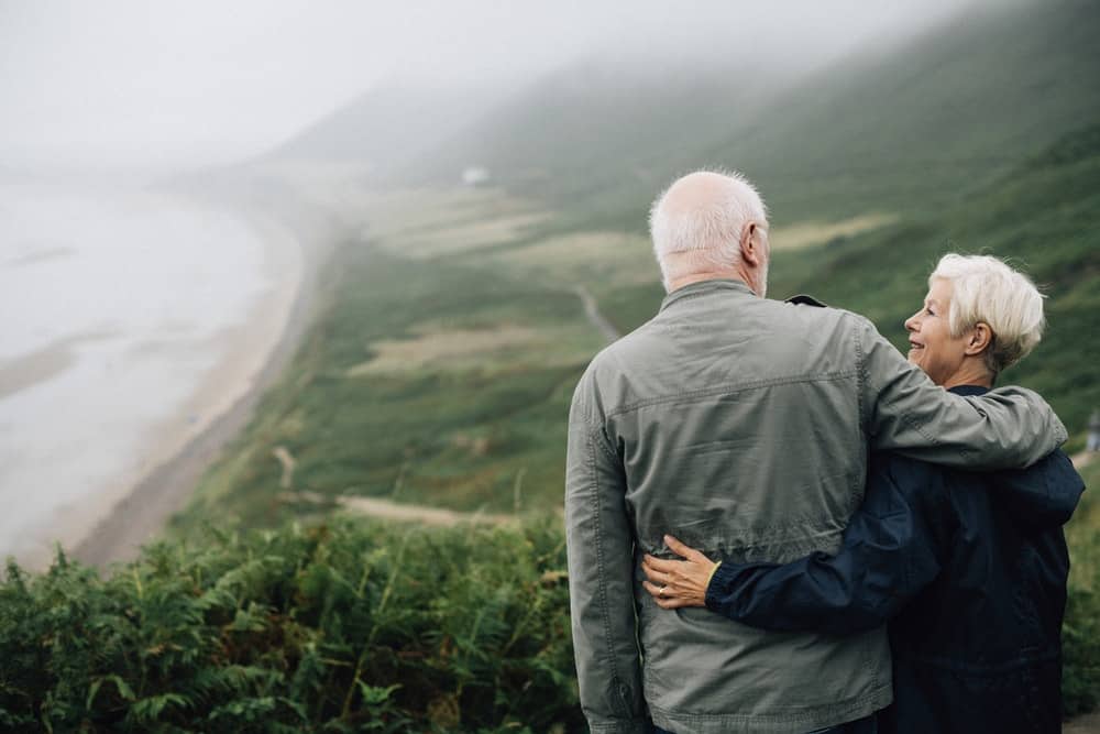 Elderly Couple overlooking a beautiful landscape
