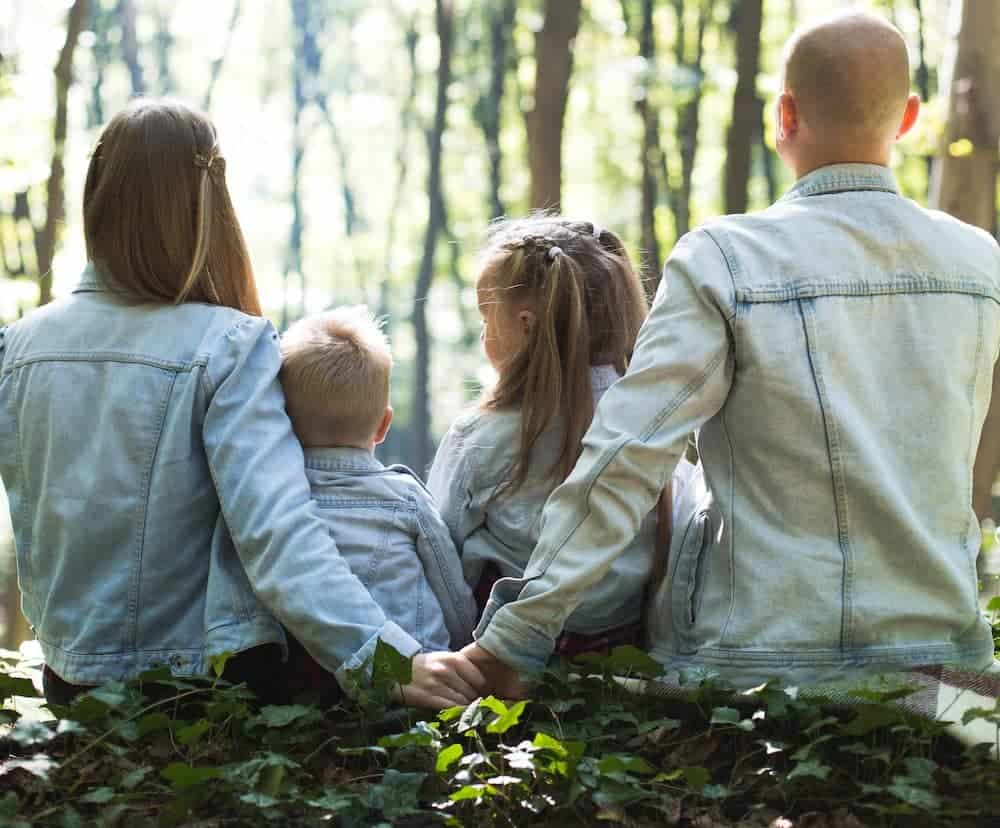 Family Sitting in a Forest