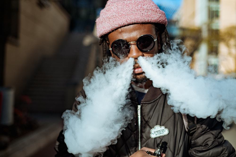 Man Blowing Smoke Through His Nose