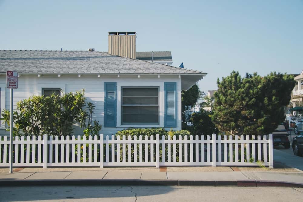 White fence around a modern home