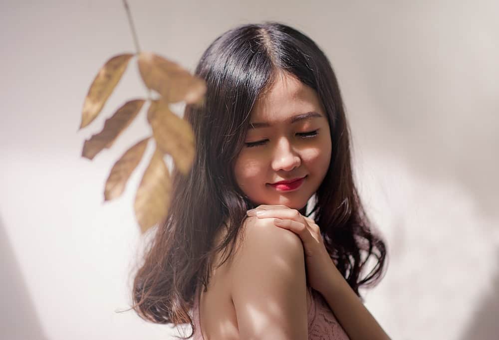 Asian Woman Wearing Brown Sleeveless Top