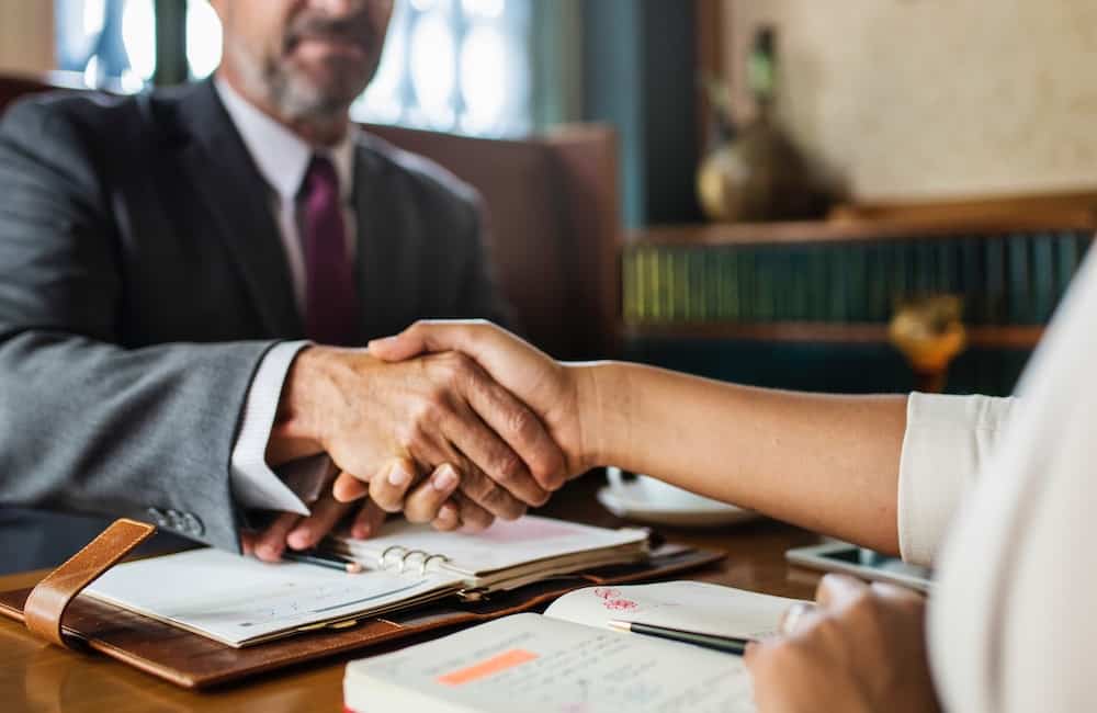 two people shaking hands