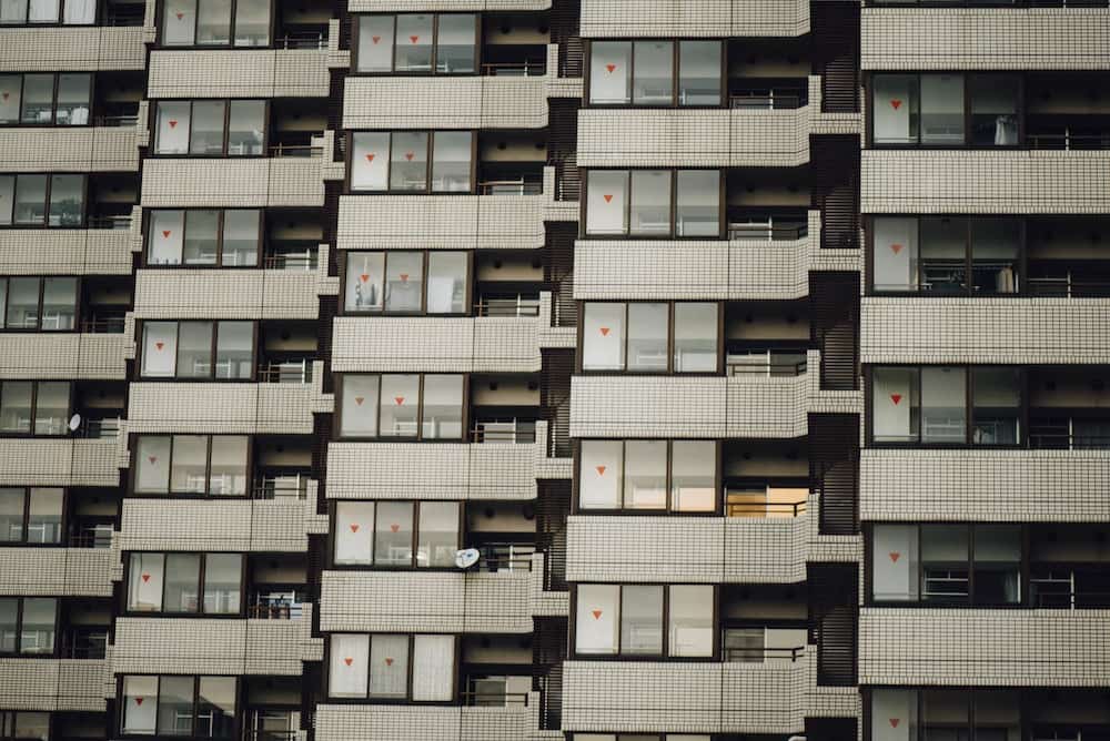 photo of white condo unit during daytime