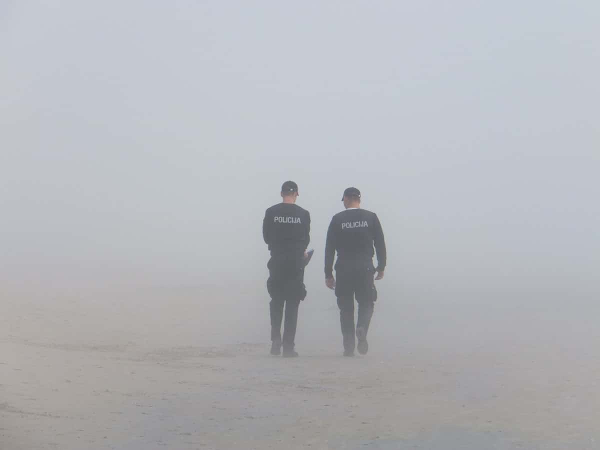 police walking into Fog