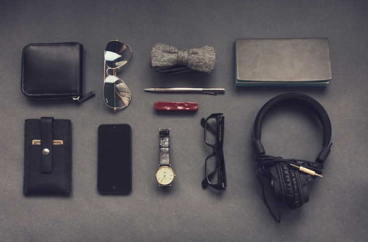 Knolling Photography of Smartphone watch, glasses, wallet, keys and other daily essentials