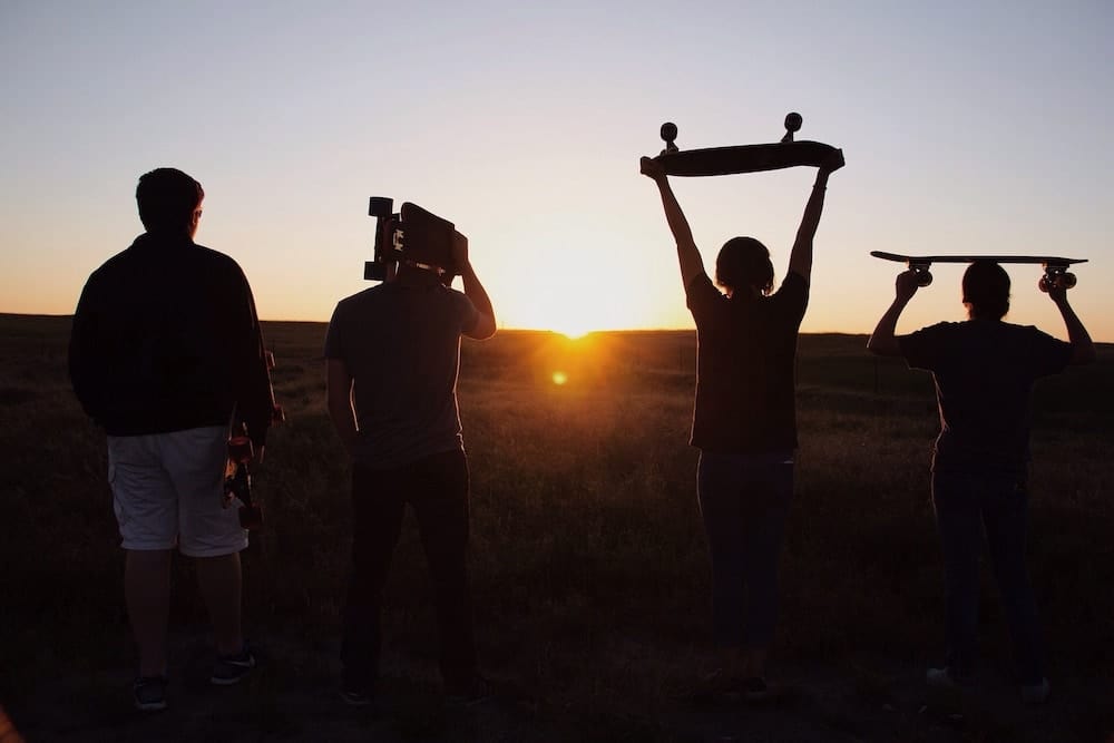 4 Skateboarder Friends Walking into the Sunset.jpg