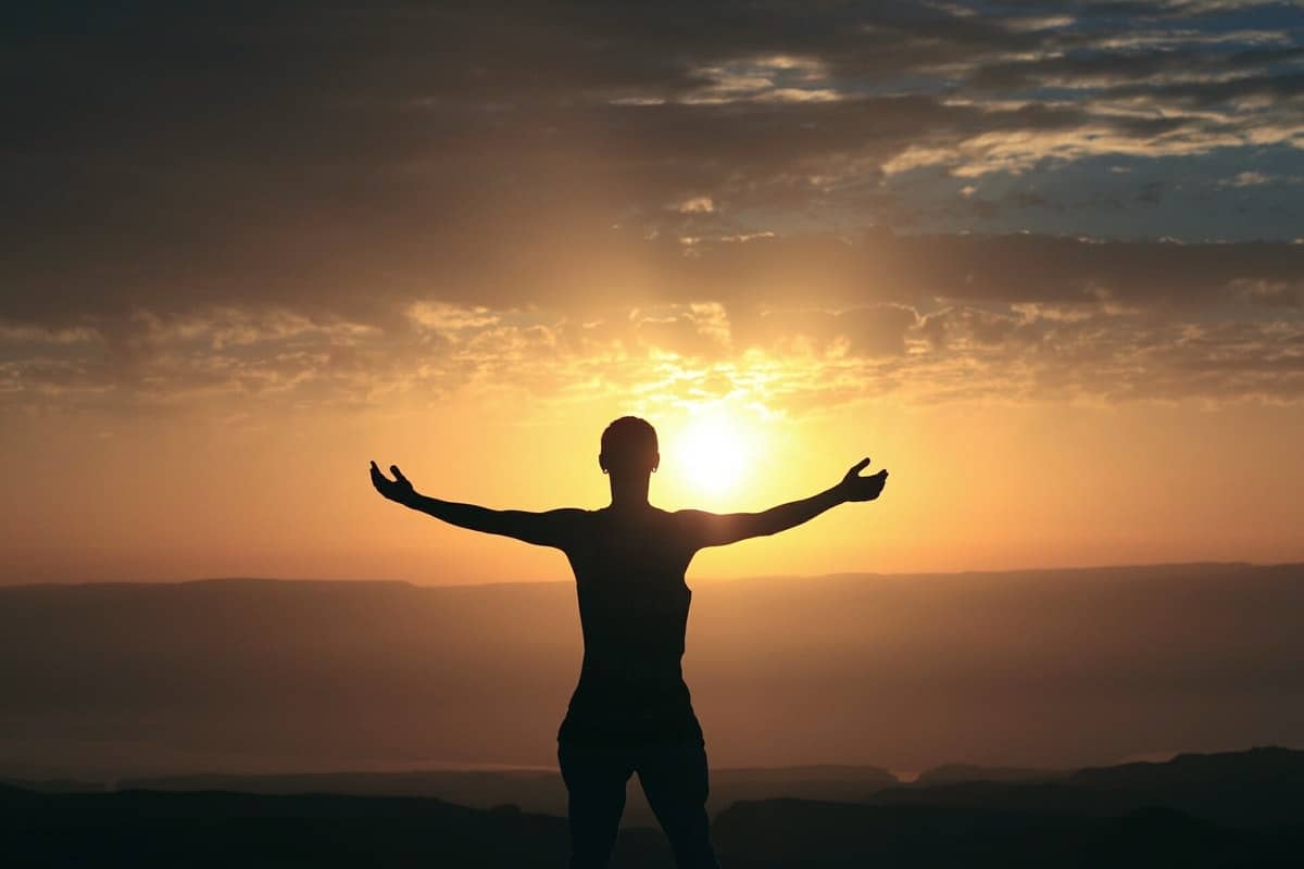 silhouette in front of a stunning sunrise